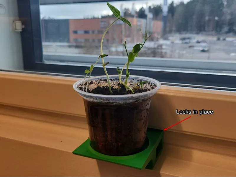 Flower pot holder under a window