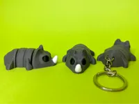 Bébé rhinocéros articulé — porte-clés — photo 1