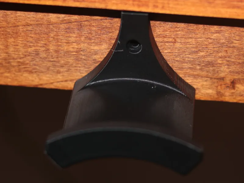 Headphone hanger with screw hole