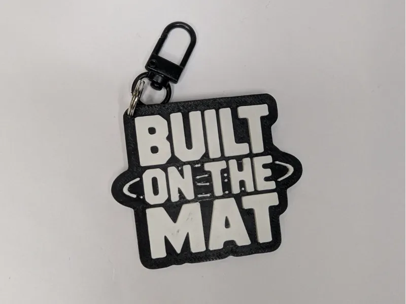built on the mat Keychain