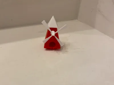 Mini golf windmill obstacle fit in starter hole.