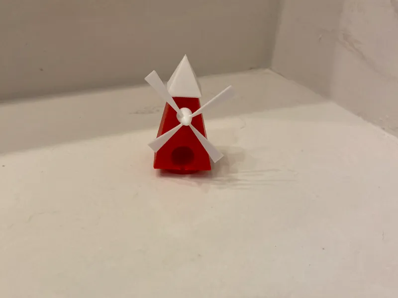 Mini golf windmill obstacle fit in starter hole.