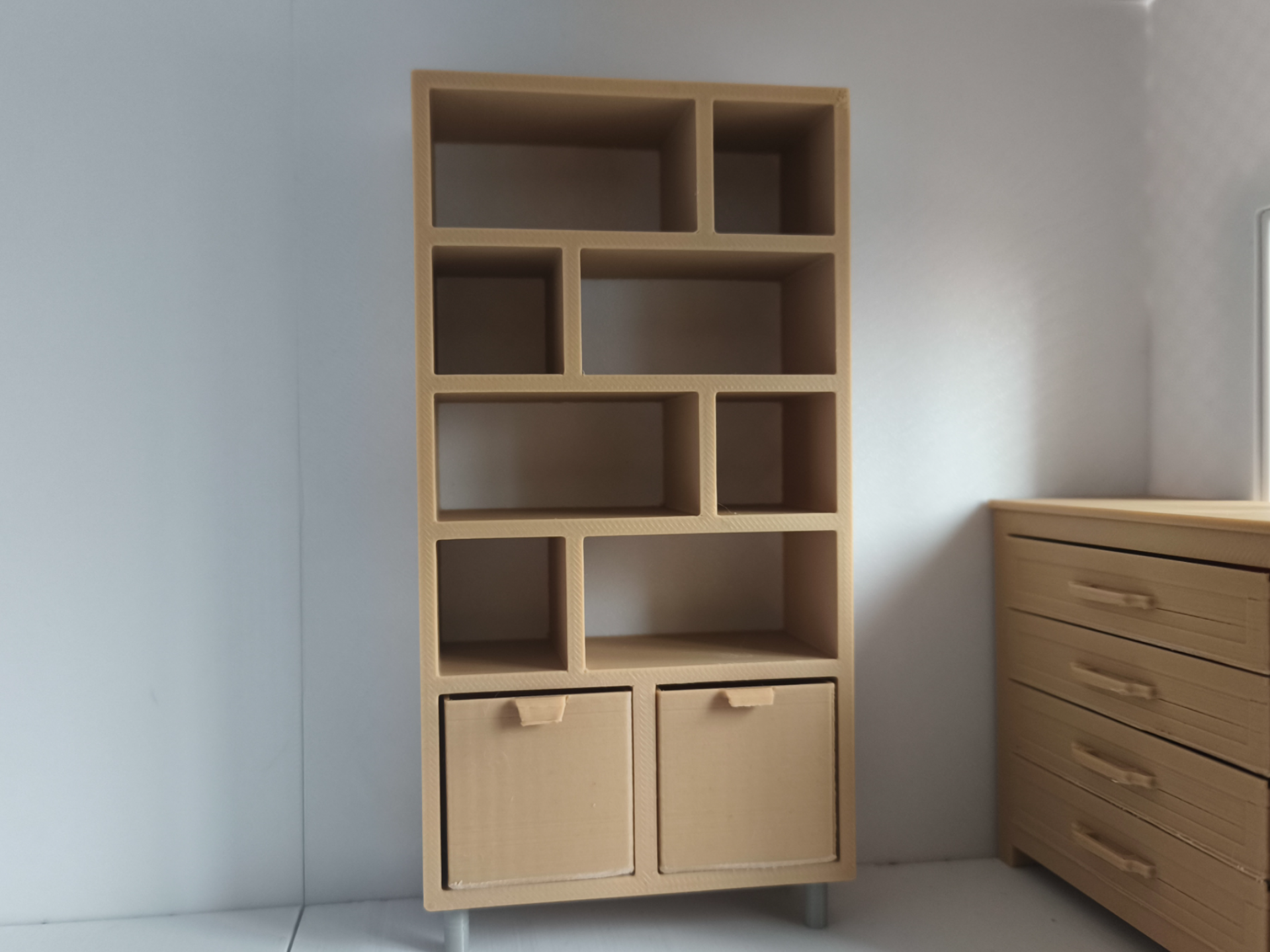 Miniature shelving unit with drawers for dolls