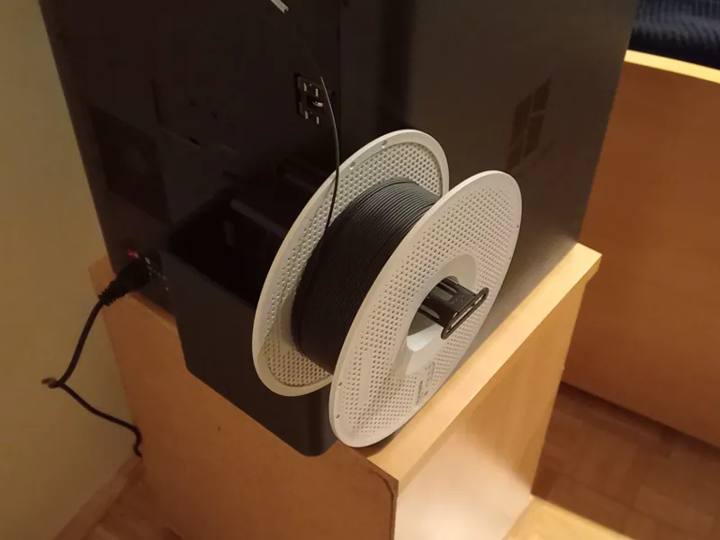 Poop chute and spool holder