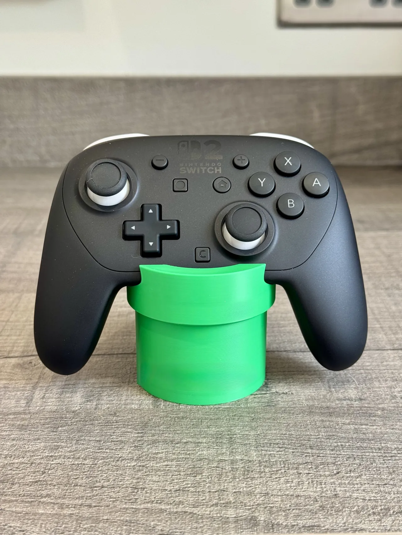 Nintendo Switch 2 Pro controller stand warp pipe view 2