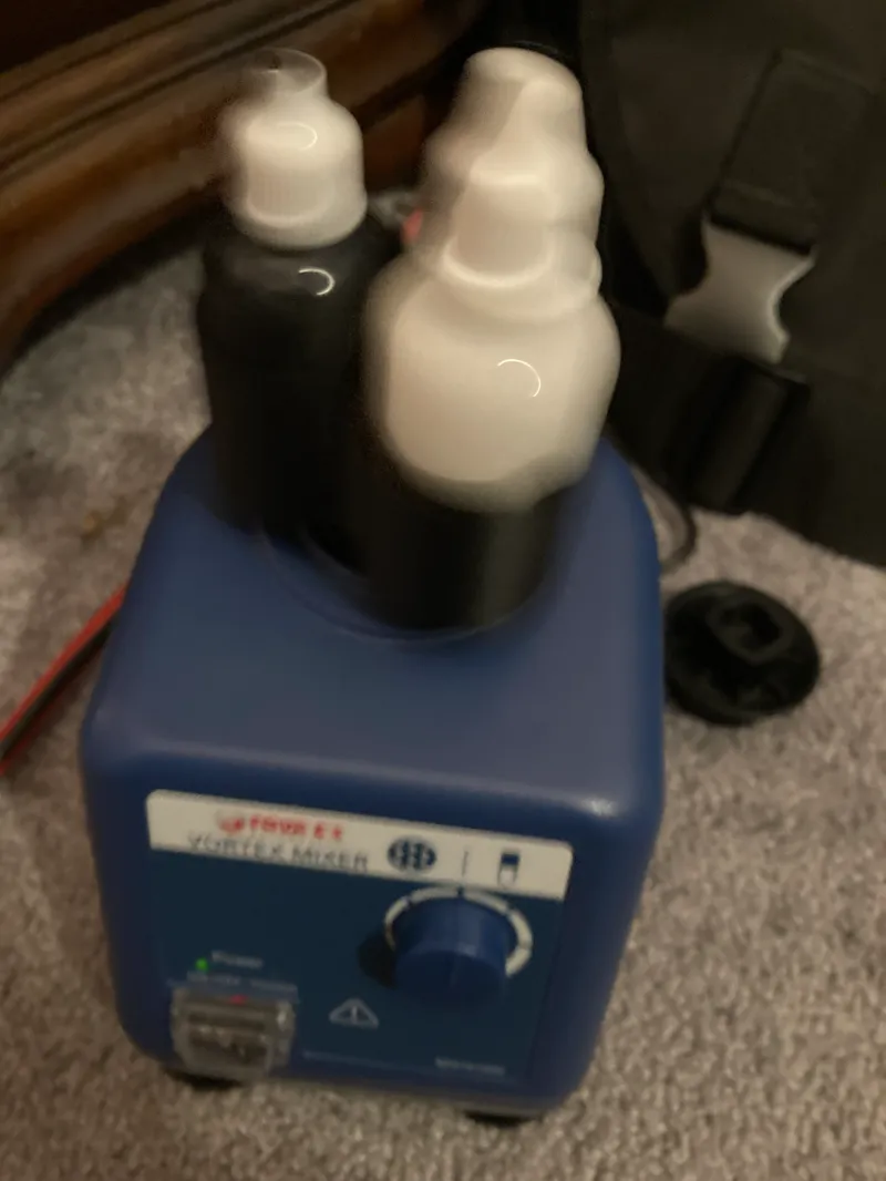 Paint caddie for vortex mixer