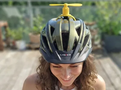 Bike helmet propeller mount w/ reusable zip tie