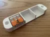 Added triangular retaining tabs to securely hold connectors.