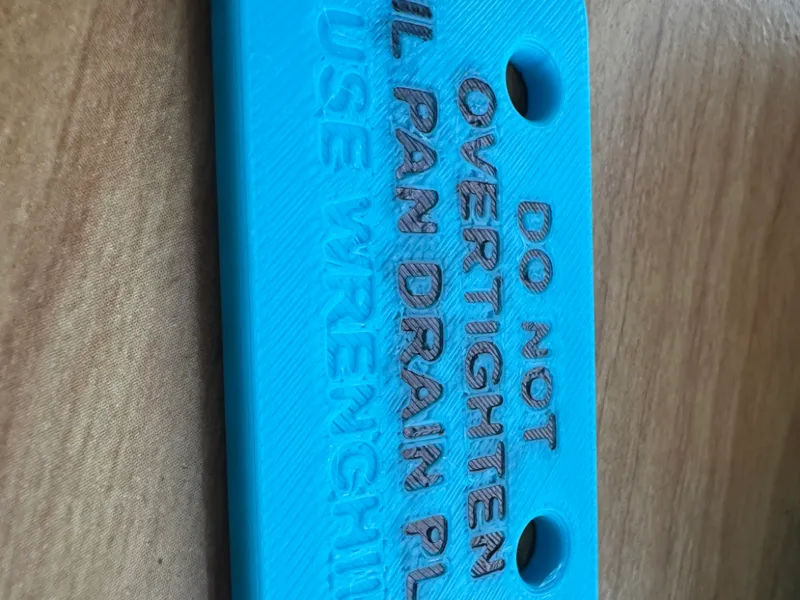 DO NOT OVERTIGHTEN OIL DRAIN PLUG SIGN