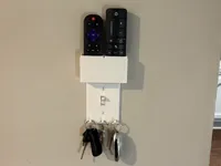 Cache-interrupteur avec rangement pour 2 télécommandes — photo 1