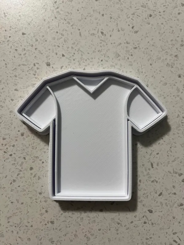 Emporte-pièce et tampon maillot de sport