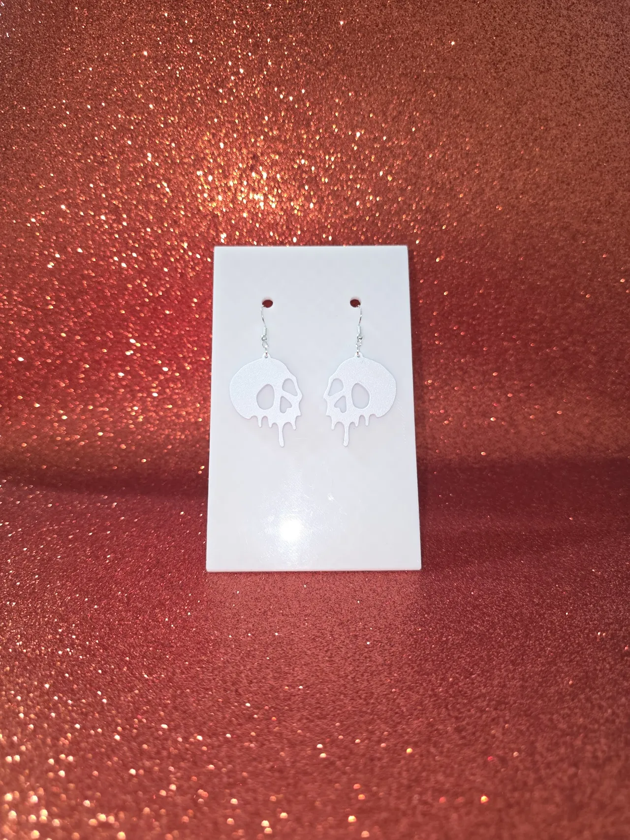 Loose skull earrings view 2