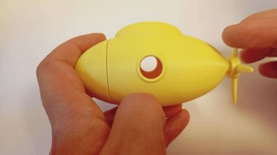 Submarine toy with spinning propeller + storage