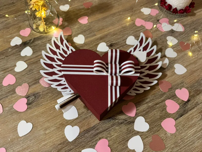 Heart-shaped gift box with wings