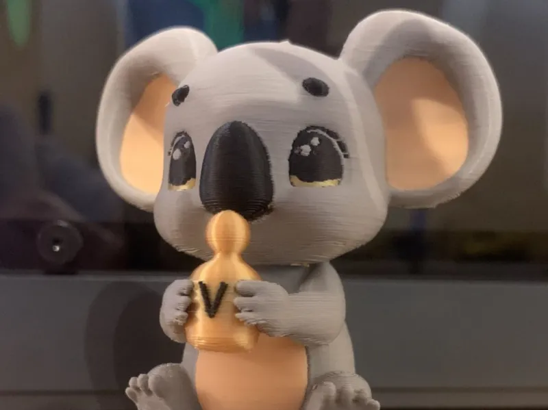 Koala holding perfume