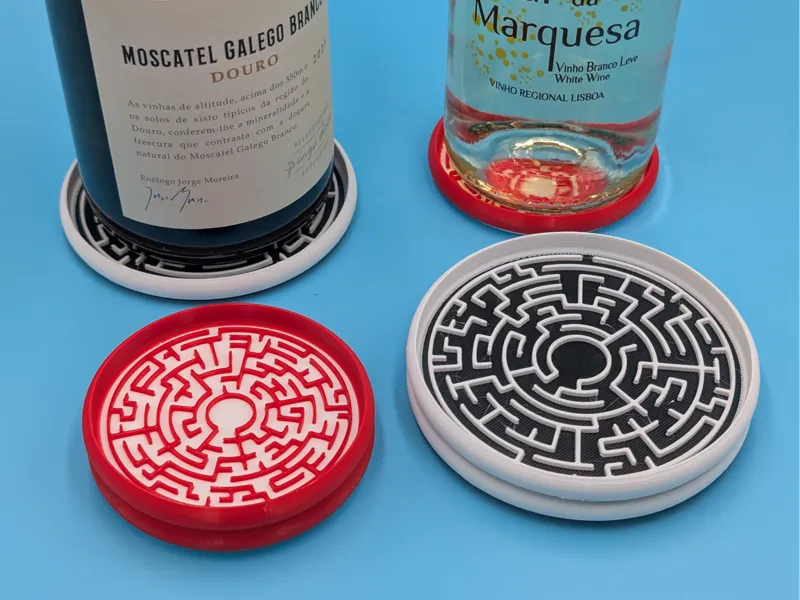 Stackable coasters with 12 unique mazes, two sizes