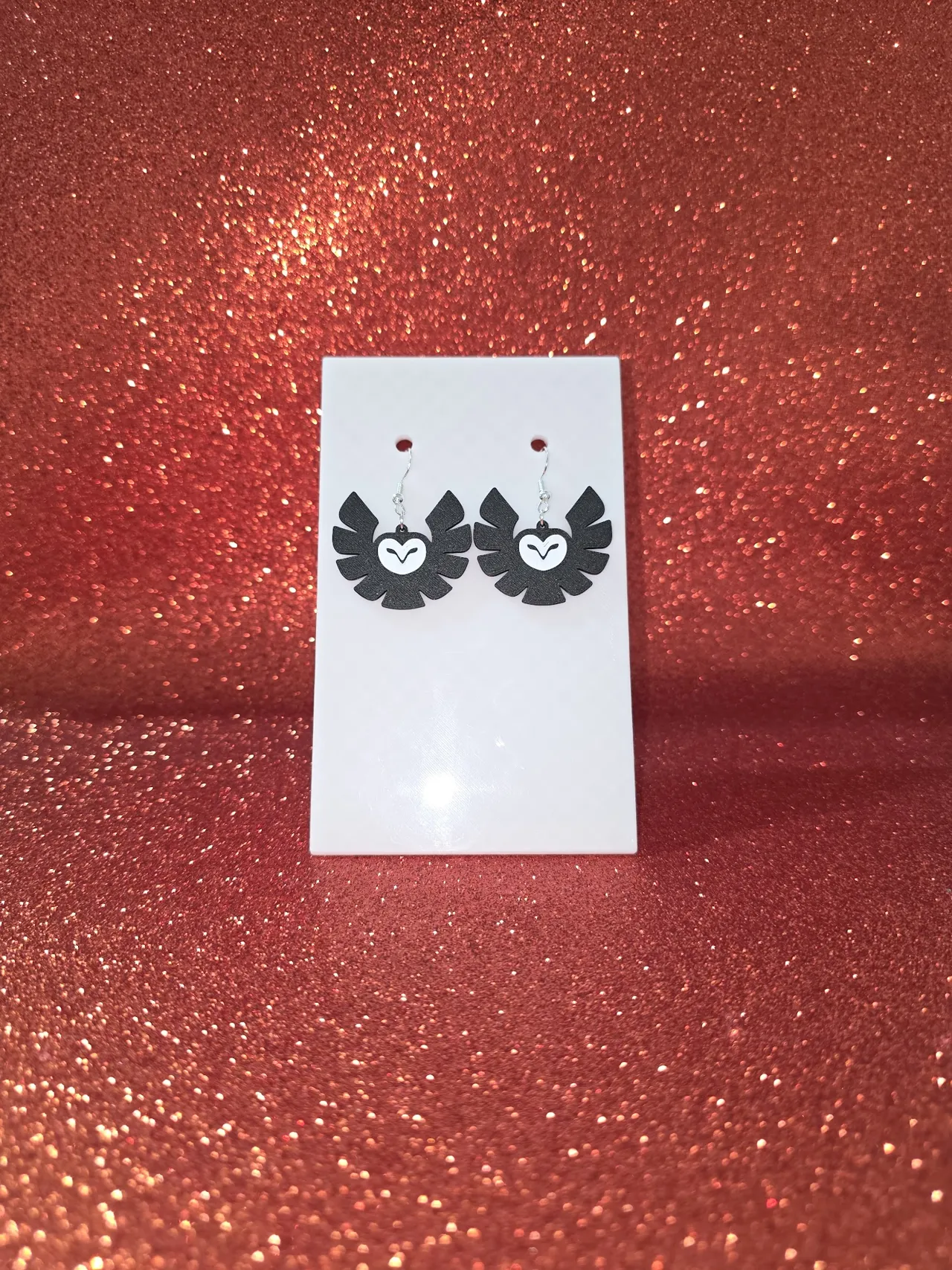 Circular owl earrings view 2