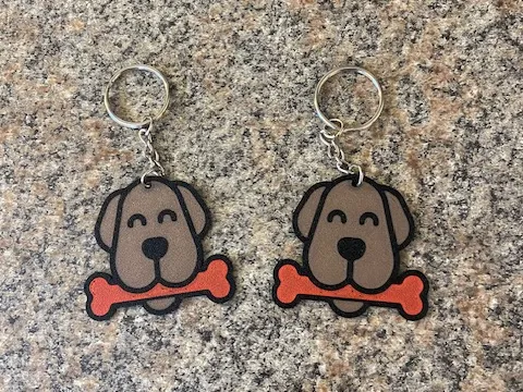 A dog with a bone Keychain