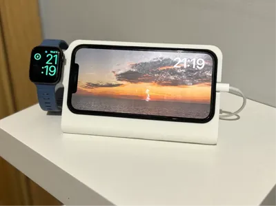 iPhone 16 Pro (w/case) and Apple Watch dock