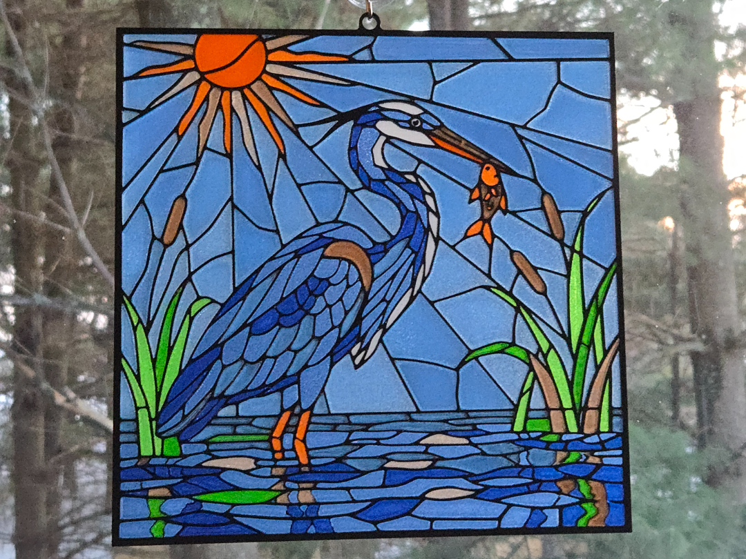 Stained glass blue heron fishing