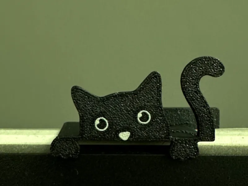 Cute Cat Peeking from the top of monitor or TV