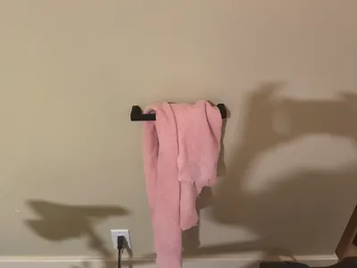 Wall mounted towel hanger
