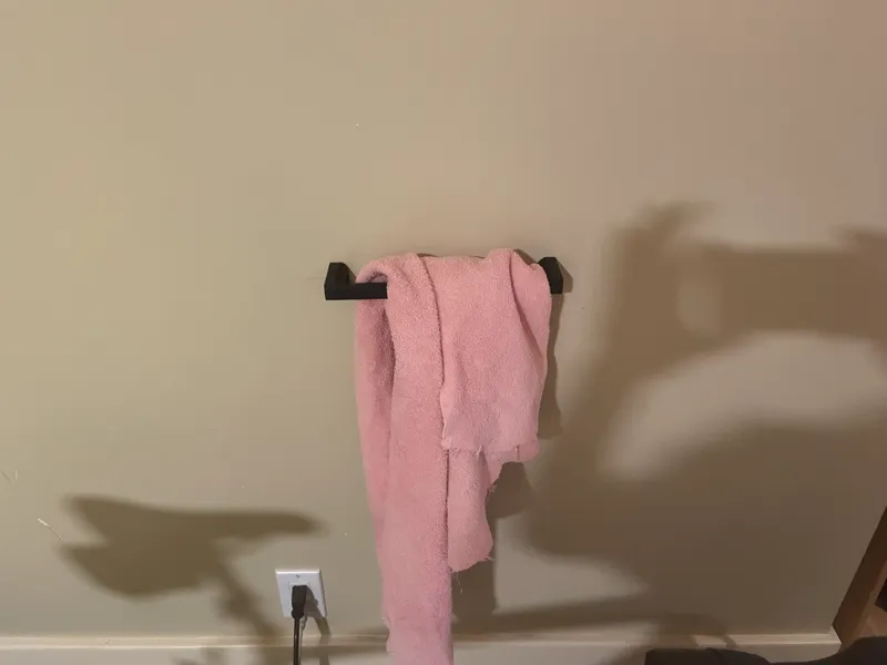 Wall mounted towel hanger