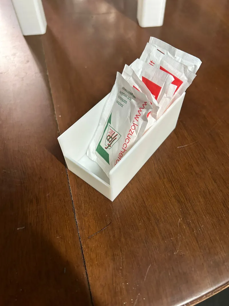 Sugar packet dispenser