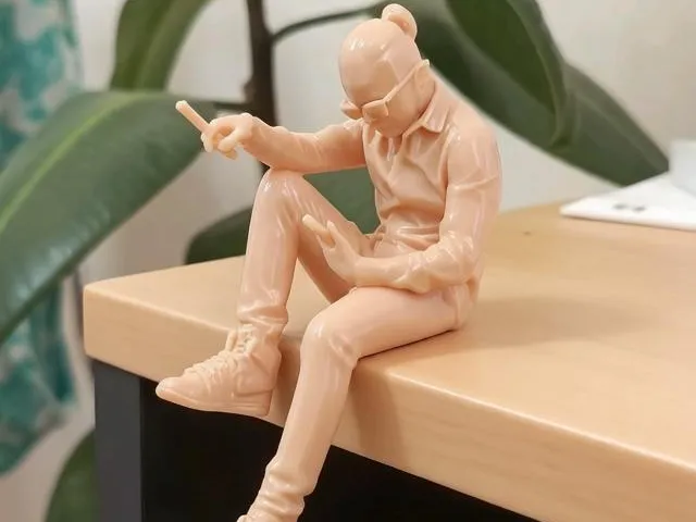 a guy is sitting on the edge in Jordans