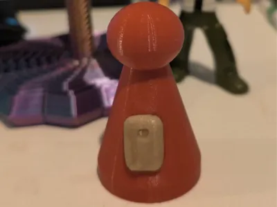 Pawn with colostomy bag for board game