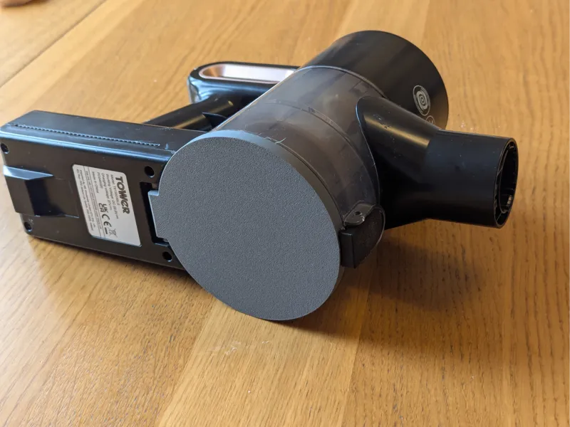 Tower vacuum cleaner base and latch