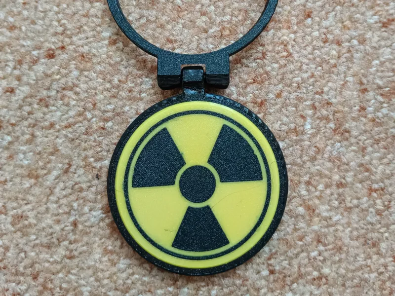 removable radioactivity emblem to lid metal can