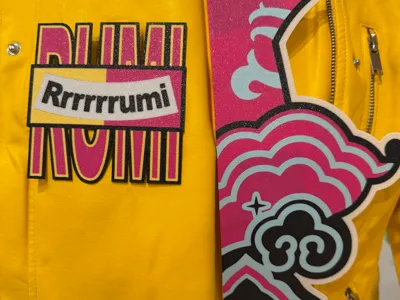 Rumi in K Pop Demon Hunters Yellow Jacket Patches 