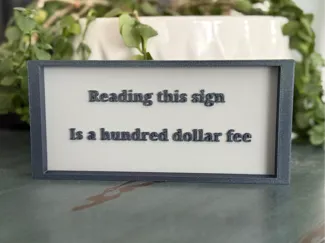 Comedy 100$ fee sign