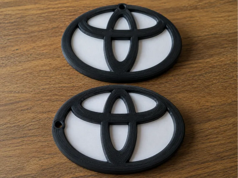 toyota logo with hole for keychain