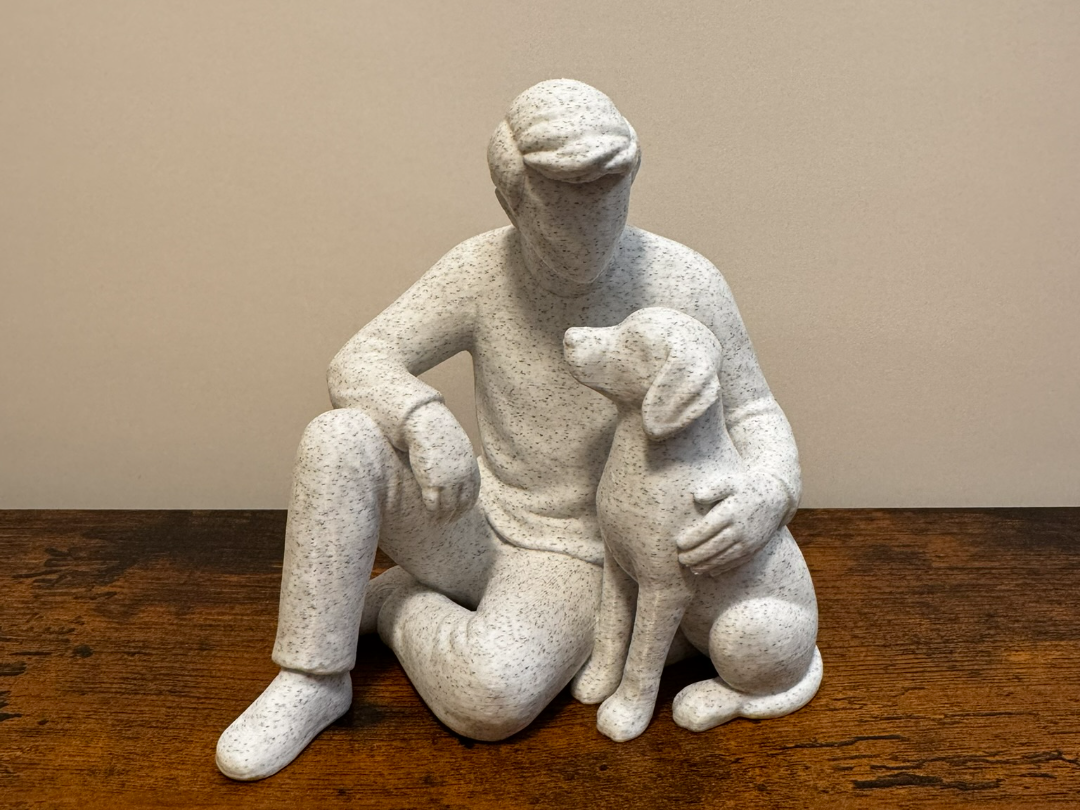 Gentle Moments: Man Sitting with Dog Sculpture