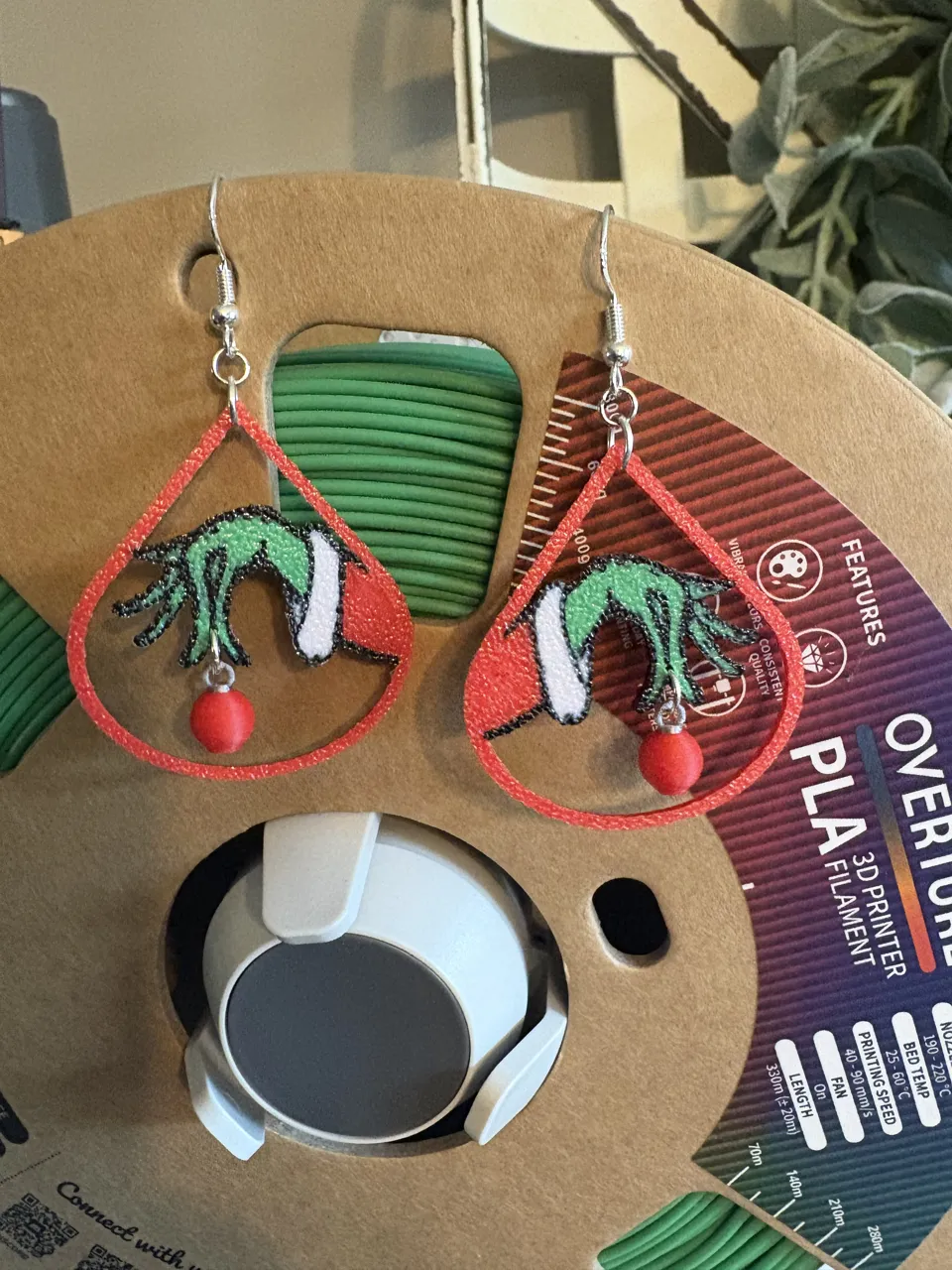 Grinch Holding Ornament Earrings view 2