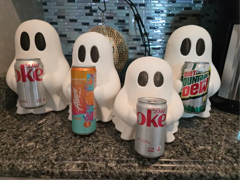 Ghosty holding soda can