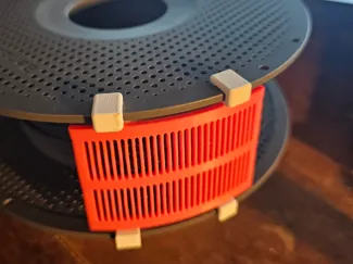 Clip-on-to-spool Desiccant container