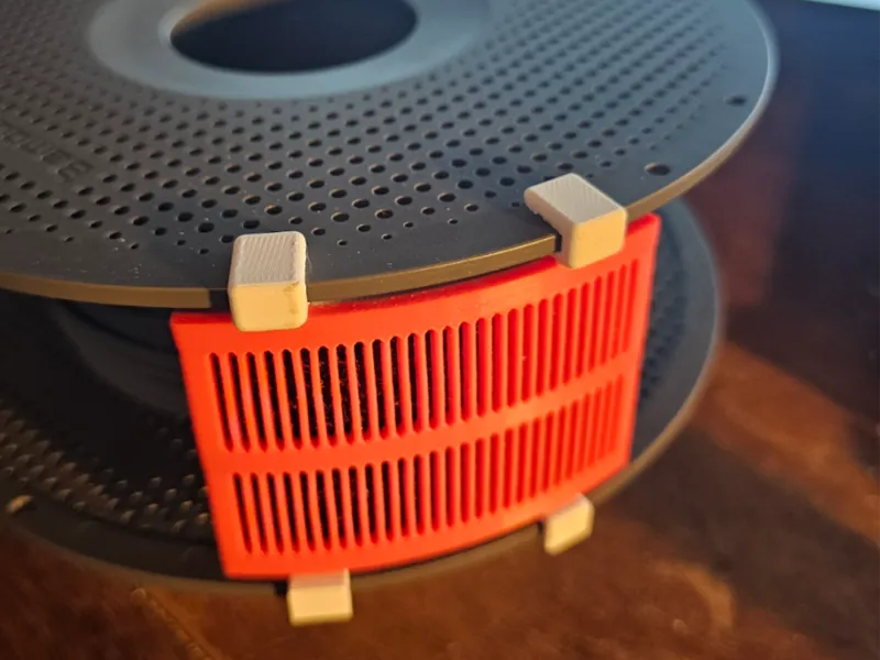 Clip-on-to-spool Desiccant container