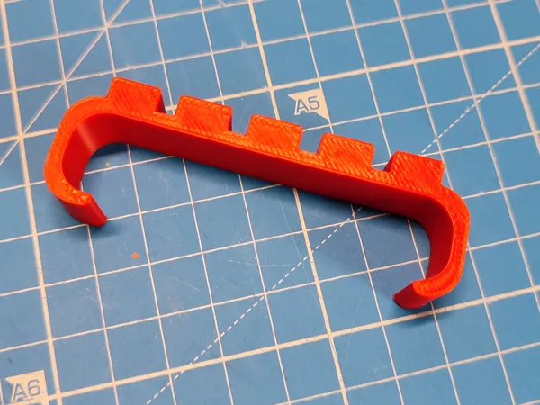 Attache câble pour batterie externe