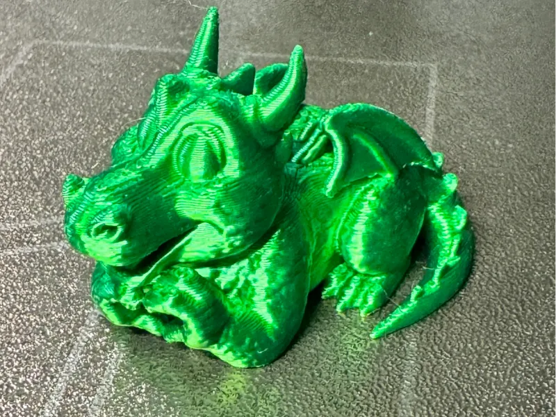 Sprout Greenfield Dragon on tummy heart