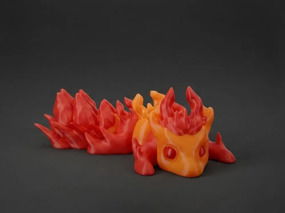 Adorno temático: Mini Ember Dragon - Flexi & Print In Place. Referencia del modelo original.