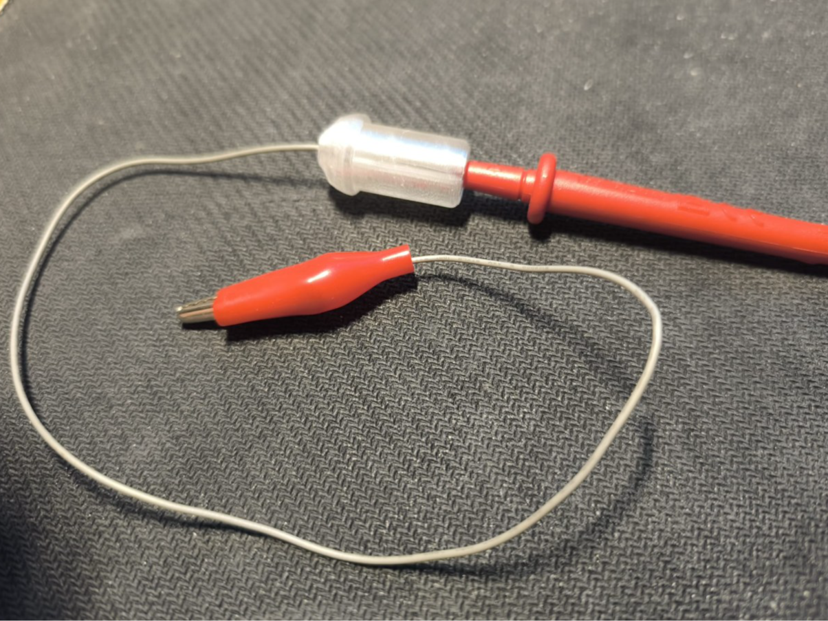 Voltmeter to alligator clip adapter.