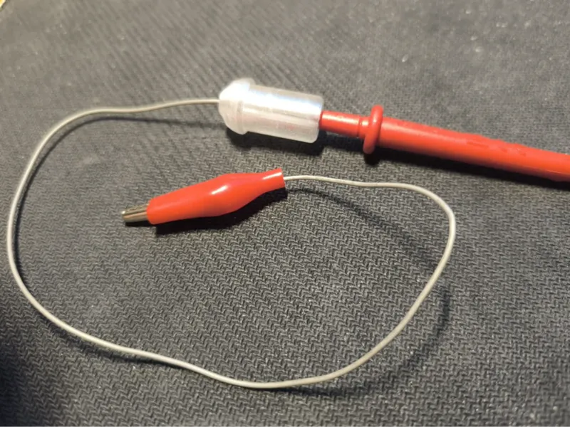 Voltmeter to alligator clip adapter.