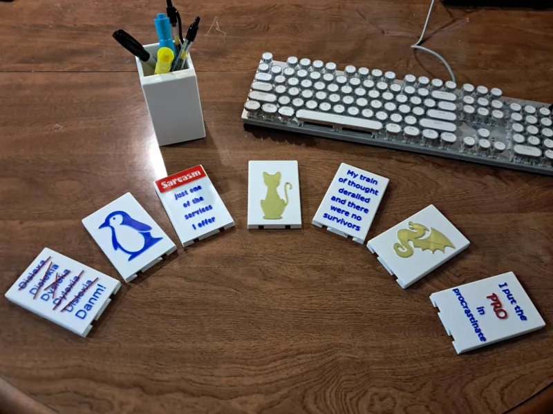 Pencil cup with interchangeable face plates