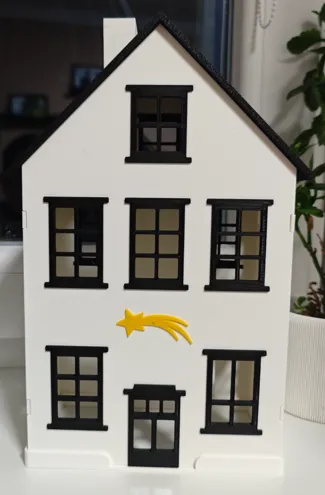 Christmas illuminated house with comet (village)