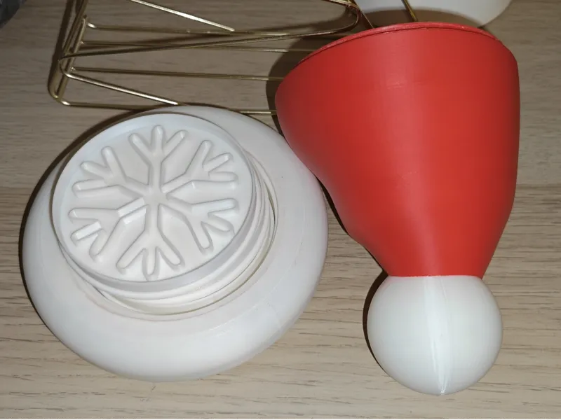 Snowflake cookie cutters in a santa hat