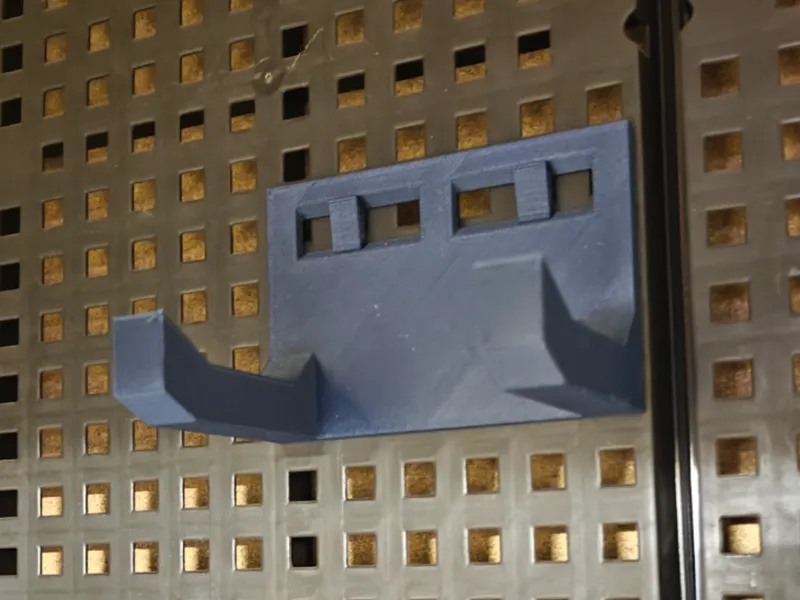 Impact or grinder holder with adjustable hooks 