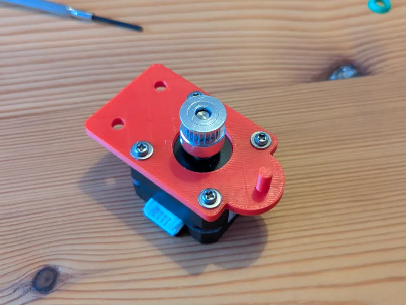 NEMA 17 stepper mount with belt return peg
